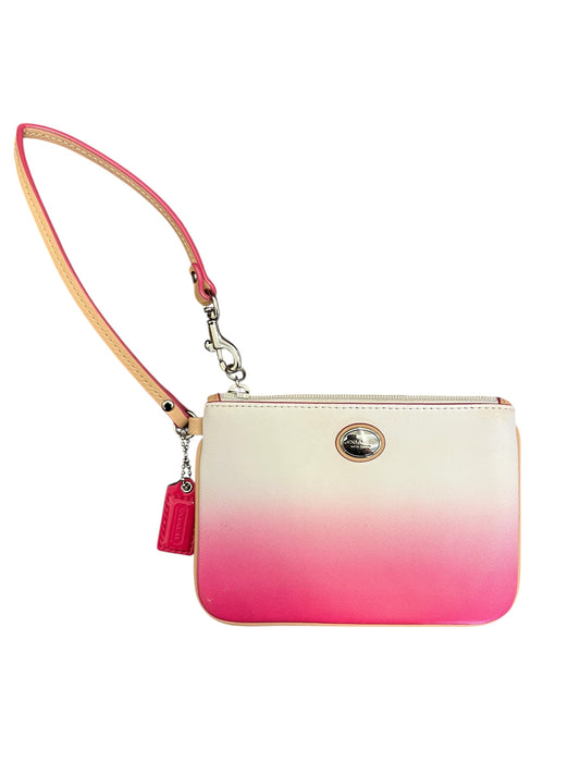 pink and white Coach wallet