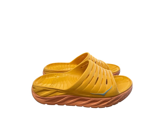 orange Hoka sandals, 11